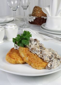 Potato patties (zrazy) with mushrooms and cream sauce