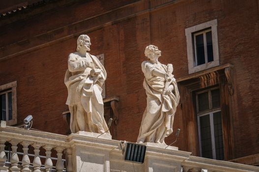 Statues on top of collonnade of St. Peters square in Rome, Italy