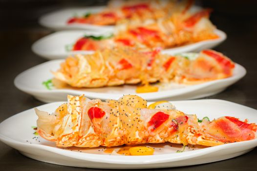 Prepared lobster and sea weed on plates