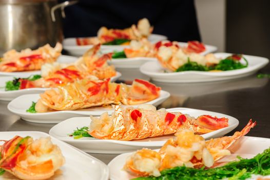 Prepared lobster and sea weed on plates