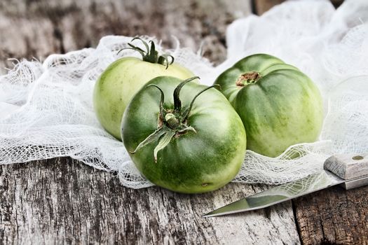 Freshly picked green tomatoes with extreme shallow depth of field.