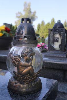 Candle on a Christian grave.