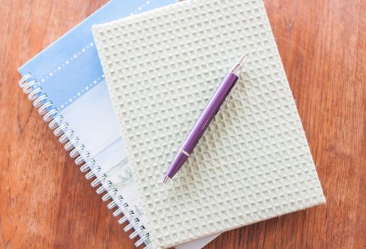 Two of notebooks and pen, stock photo