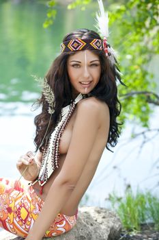 Young woman in costume of American Indian