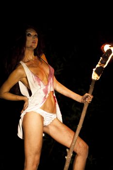 Mysterious Amazon with torch in hand