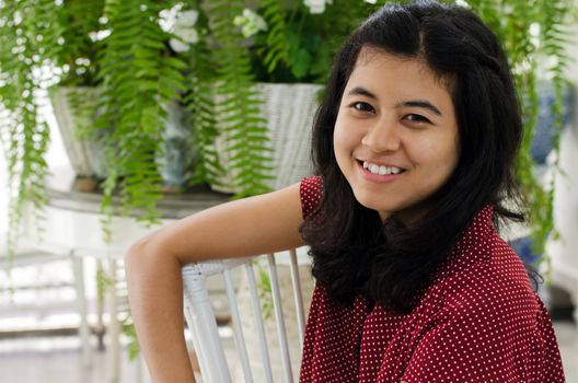 Beautiful asian girl at vintage home with plant decoration