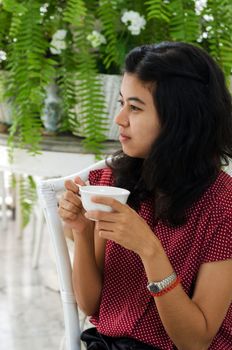 Woman at home with a cup of tea