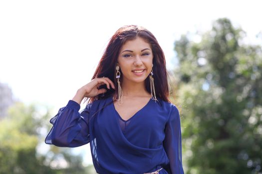 Young happy woman in summer dress