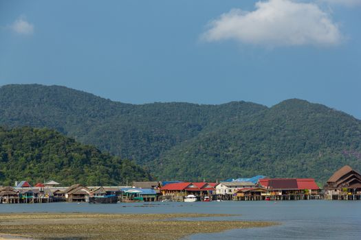 beach house on the sandy coast of blue sea