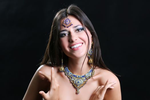 Young beautiful brunette woman in indian blue dress