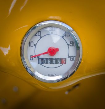 A Mustard Yellow Retro Vintage Moped Speedometer
