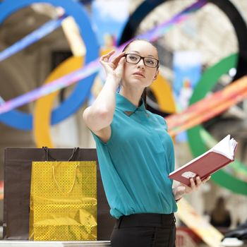 Beautiful young business woman in the store