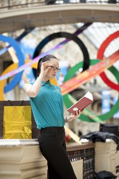 Beautiful young business woman in the store