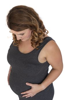 adult pregnant woman holding her hands on her belly