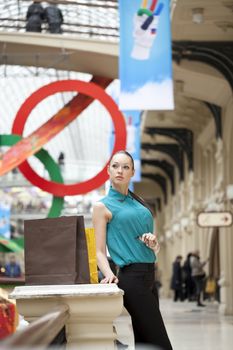 Beautiful young business woman in the store