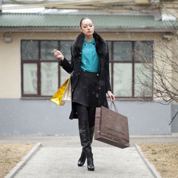 Young beautiful woman in winter day