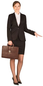 Businesswoman holding a briefcase and shows his hand towards. Isolated on white background