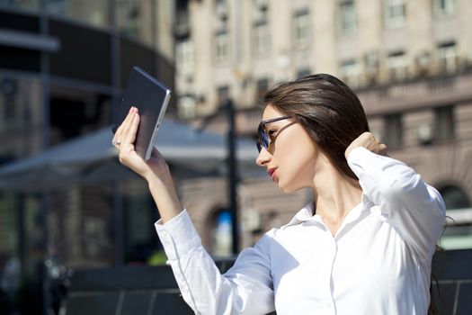 Young Beautiful business woman reading notepad