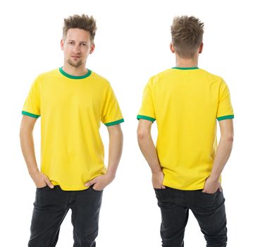 Photo of a man wearing blank yellow and green t-shirt, front and back. Ready for your design or artwork.