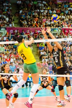 BANGKOK - AUGUST 17: Jaqueline Maria Pereira de Carvalho Endres of Brazil Volleyball Team in action during The Volleyball World Grand Prix 2014 at Indoor Stadium Huamark on August 17, 2014 in Bangkok, Thailand.