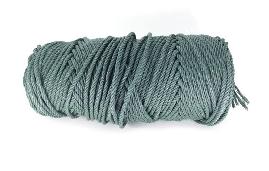 A coil of green rope on white background