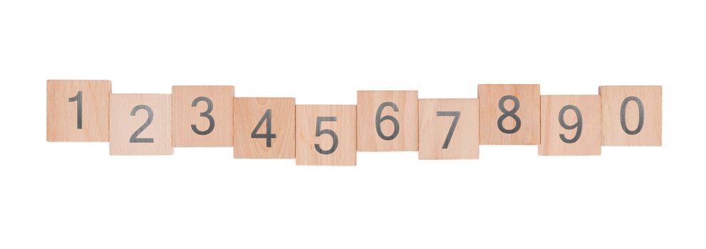 Ten child’s wooden blocks, isolated on a white background