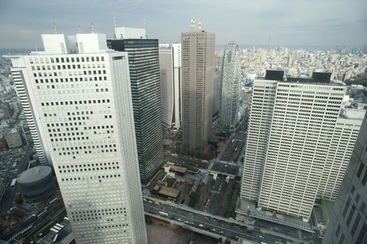 City Overview of Shinjuku, Tokyo, Japan with Skyscrapers and Cloudy Sky