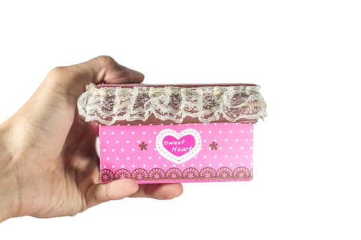 close up of man hands holding a pink gift box on the day of love. isolated on white.