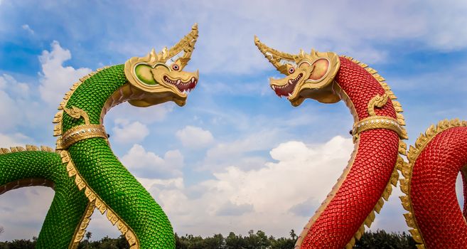 Thai dragon or king of Na-ga statue on blue sky background.