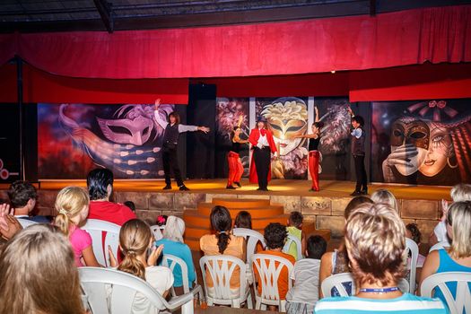 BORJ CEDRIA, TUNISIA - AUGUST 9: Performers and animation team in main program "Show Time" at the Carribean World Resort on August 9, 2014 in Borj Cedria, Tunisia. 