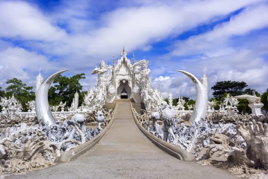 Road to White Temple, is a contemporary unconventional Buddhist temple in Chiang Rai, Thailand.