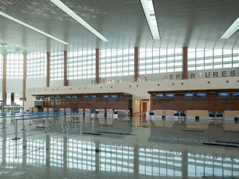 Empty check-in desks at International Departures at Nay Pyi Taw International Airport, Myanmar.