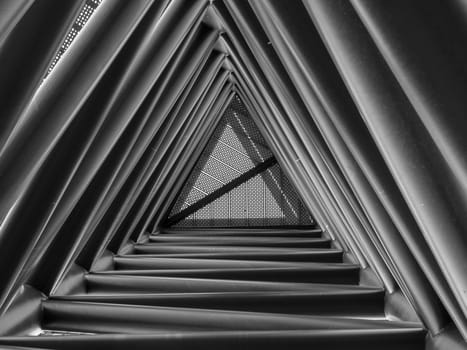 Looking up through triangle structure inside stairway