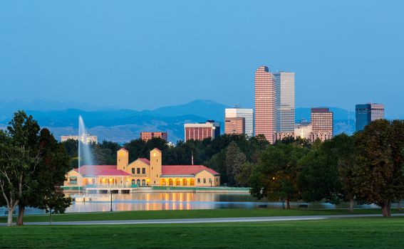 City skyline of Denver Colorado from the City Park taken from front of Science Museum just before sunrise with the fountain and Boathouse and Ferril Lake