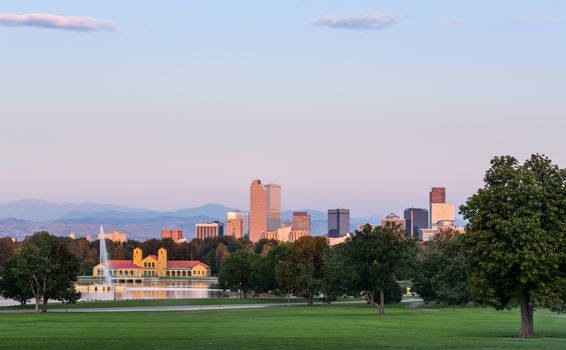 City skyline of Denver Colorado from the City Park taken from front of Science Museum just before sunrise with the fountain and Boathouse and Ferril Lake