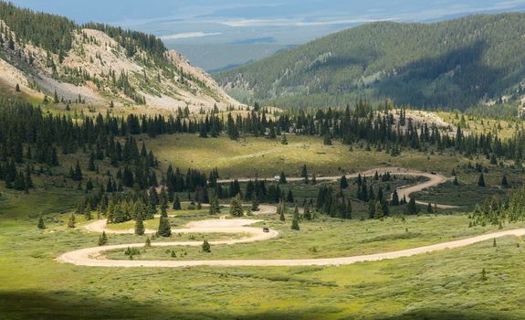 Series of bends on unfinished or dirt road climbing to top of Cottonwood Pass in Colorado