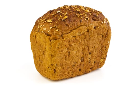 A loaf of bread with sunflower seeds, sesame seeds and grains of wheat on a white background