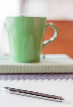 Closeup pen on spiral notebook, stock photo