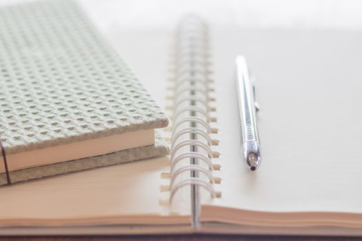 Green covered notebook and pen , stock photo