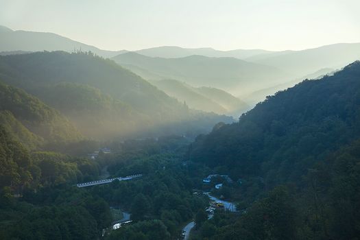 Morning sun's rays in the mountain gorge