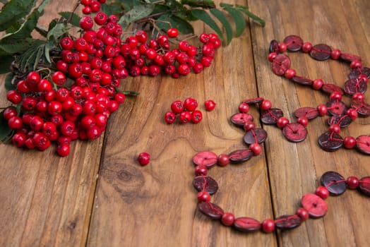 rowanberries on wooden table