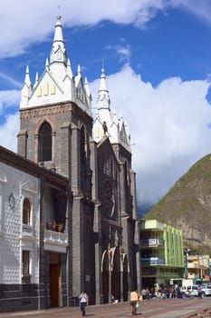 BANOS, ECUADOR - FEBRUARY 26, 2014: Unidentified people at the Basilica de la Virgen (Basilica of the Virgin) on February 26, 2014 in Banos, Ecuador. Banos and its basilica is a place of pilgrimage for Ecuadorians because of the wonders that are said to have happened in that place. 