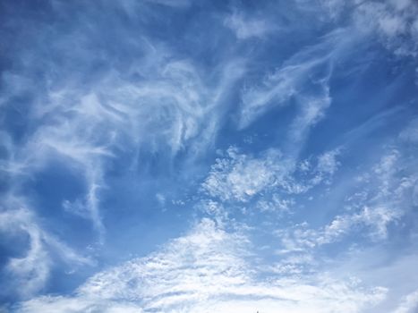 blue sky background with tiny clouds