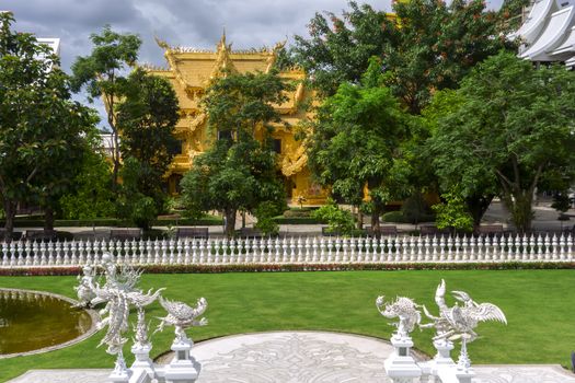 Garden View of White Temple. Contemporary unconventional Buddhist temple in Chiang Rai, Thailand.