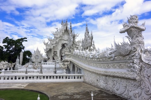 Bridge to White Temple, Contemporary unconventional Buddhist temple in Chiang Rai, Thailand.