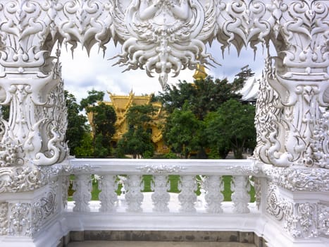 Architectural Details of White Temple Entrance. Contemporary unconventional Buddhist temple in Chiang Rai, Thailand.