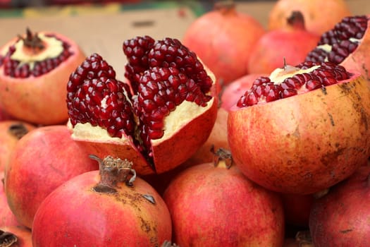 Pomegranate open wide on display at the fruits market