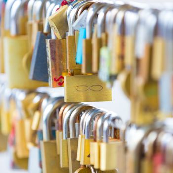 Lockers at the bridge symbolize love for ever. Lovers lock the locker on fance and throw key in river to be lost forever.
