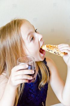 Photo of eating cute girl with blond hair