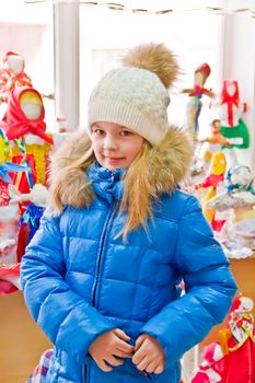 Photo of cute girl with blue eyes in white hat